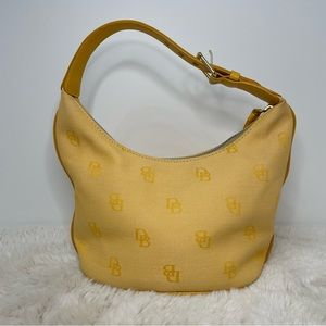 Small Yellow Cloth and Leather Dooney & Burke Handbag. Very light stain on back